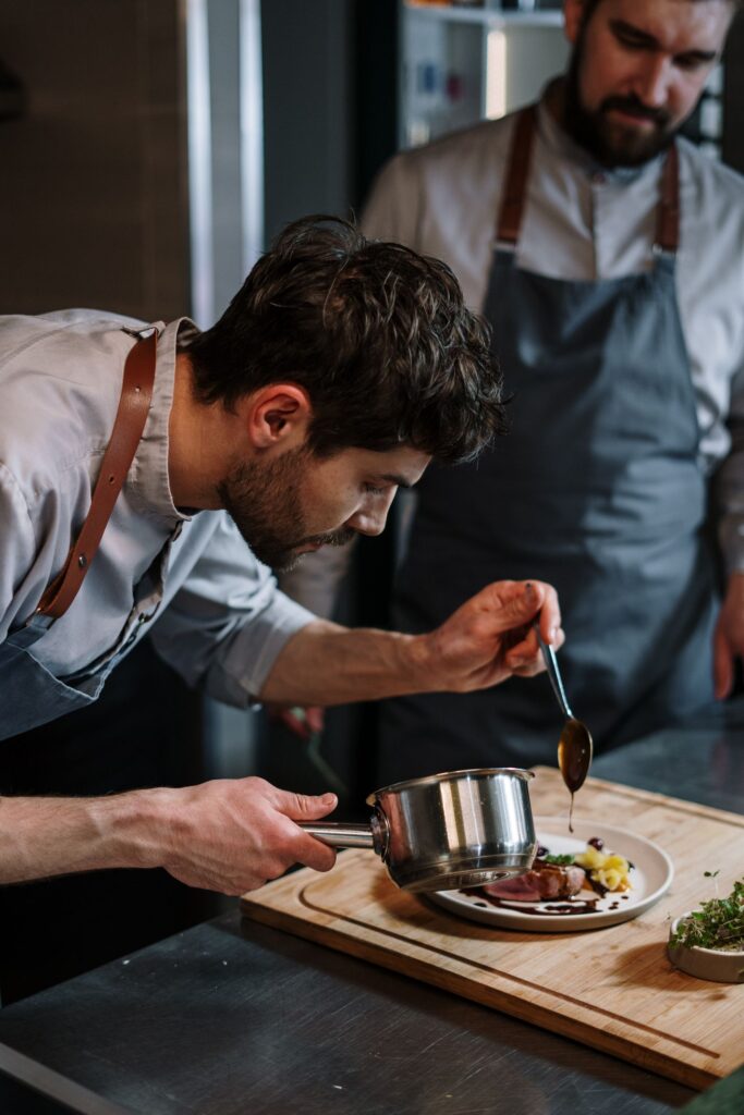 Beautifully plated dish at a chef’s counter