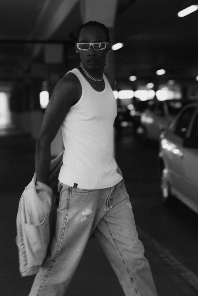 Stylish individual in an urban parking garage